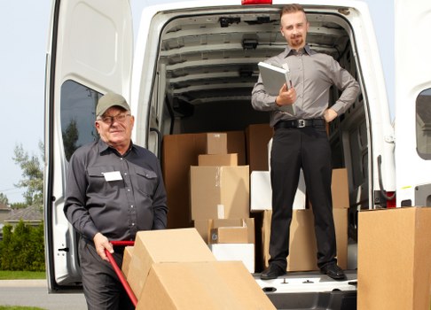 Packed boxes and furniture ready for house movers in Shooters Hill