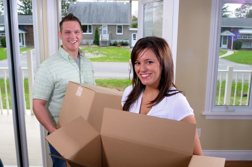 Furniture and boxes being loaded into a removal van