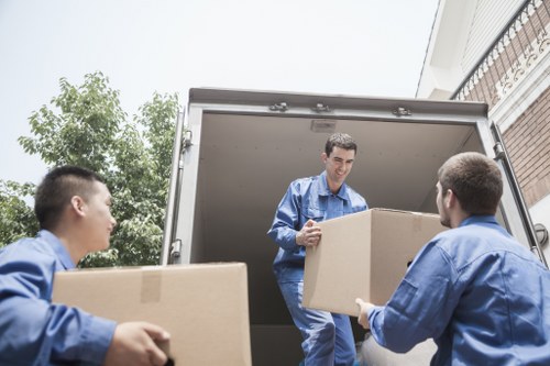 Loading household and office items into a moving van