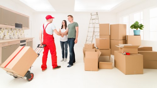 Professional removals team handling boxes and furniture in Shooters Hill