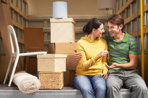Local removals team handling boxes and furniture for a Shooters Hill move